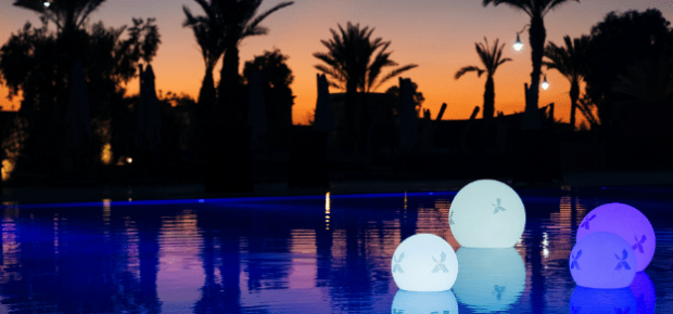 kick off event swimming pool at sunset image